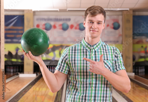 Smiling boy with ball in bo...