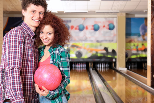 Couple having fun in bowlin...