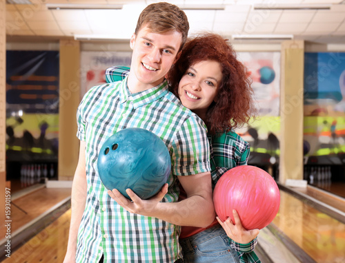 Couple having fun in bowlin...