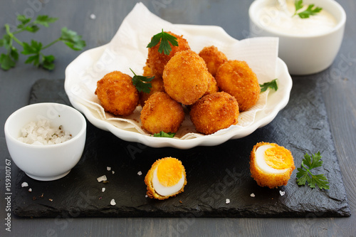 Quail eggs, deep fried with white sauce.