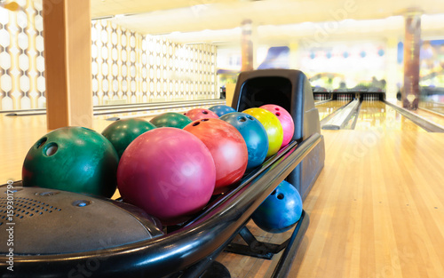 Colorful bowling balls in return machine