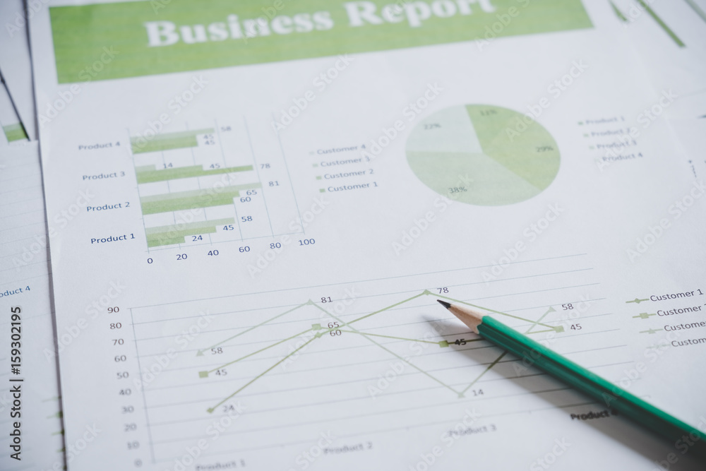 Many charts and graphs with pencil. Reflection light and flare. Concept image of data gathering and statistical working. Many charts and graphs with pencil. Reflection light and flare. Concept image of data gathering and statistical working.