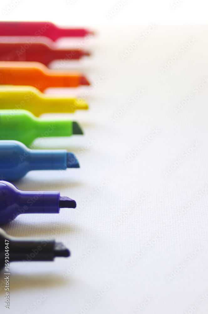 Fototapeta premium Rainbow colored marker tips on white background