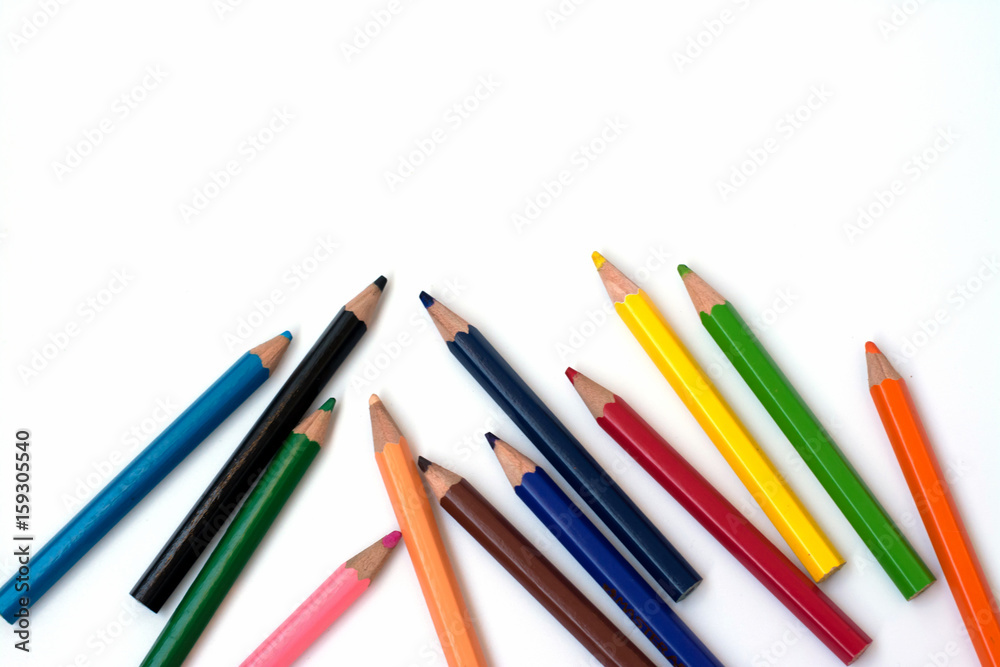 Color pencils on white background, copy space. Color pencils on white background, copy space.