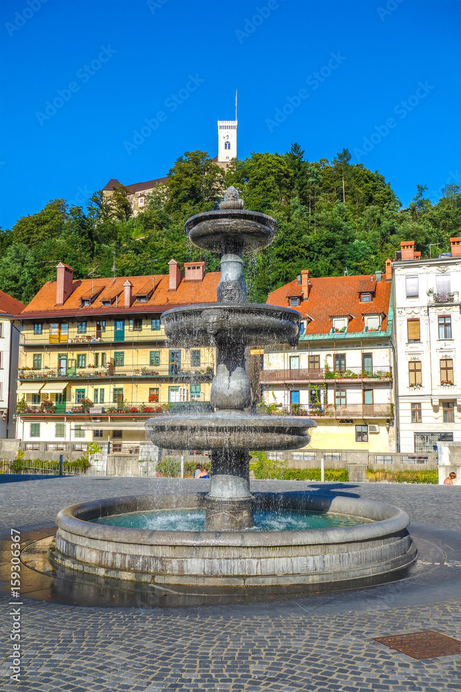 Fountain and Castle, Slovenia, Europe. Cityscape of the Slovenian capital Ljubljana.