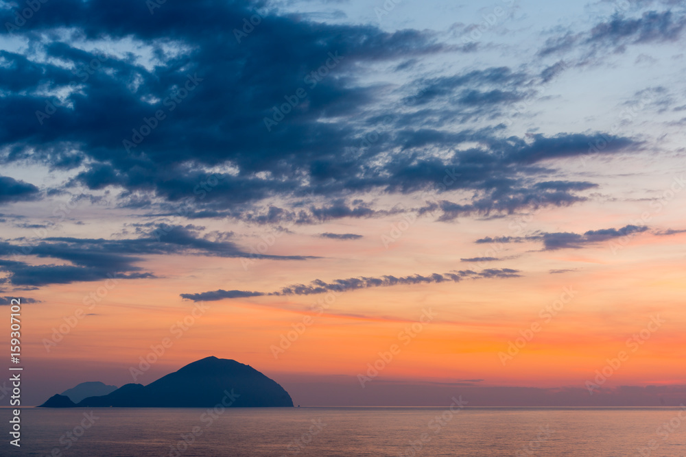 Beautiful colorful Filicudi and Alicudi eolian islands view at sunset in summer from Pollara in Salina island