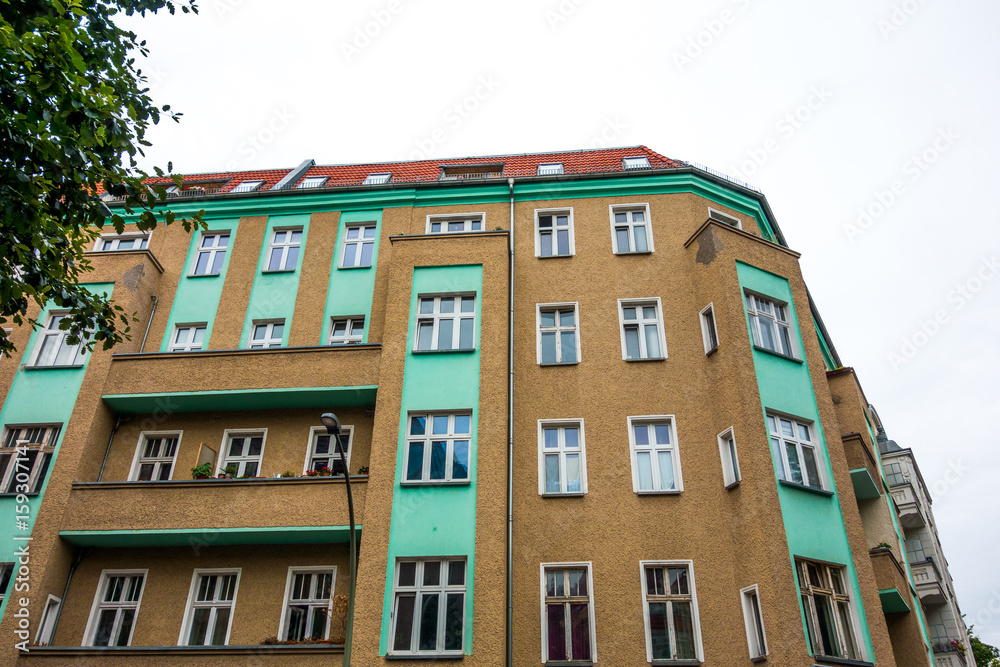 brown and green apartment building at berlin