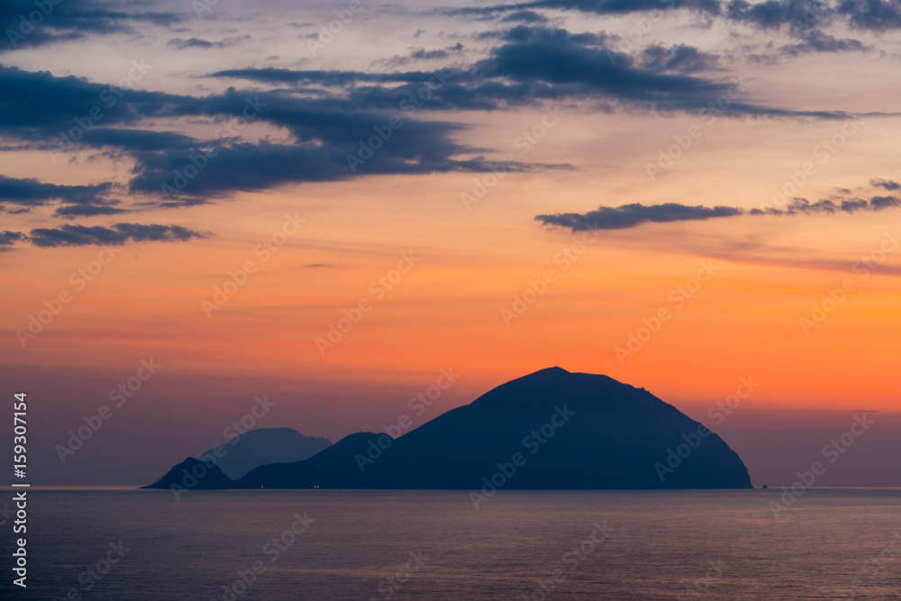 Beautiful colorful Filicudi and Alicudi eolian islands view at sunset in summer from Pollara in Salina island