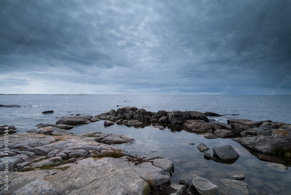 The sun shines over the small rocky island of the Swedish archipelago's outer part. The sun shines over the small rocky island of the Swedish archipelago's outer part.