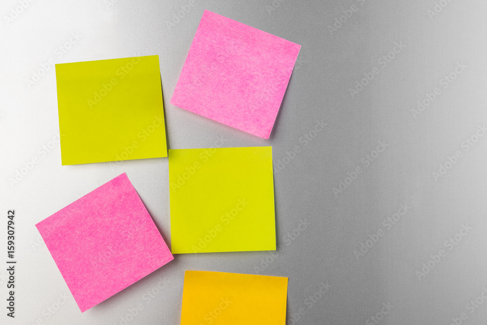 blank Sticky  note  on refrigerator , five paper sheet background.