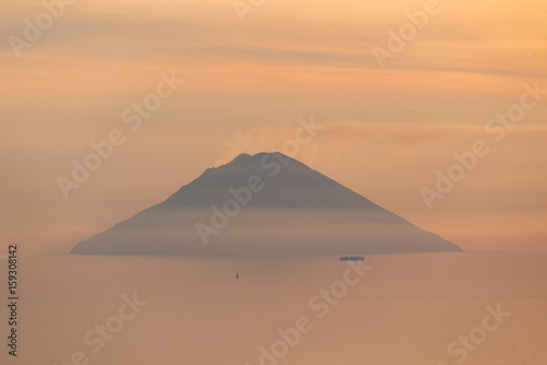 Volcano Stromboli view at sunrise sunset from Salina Eolian island in summer