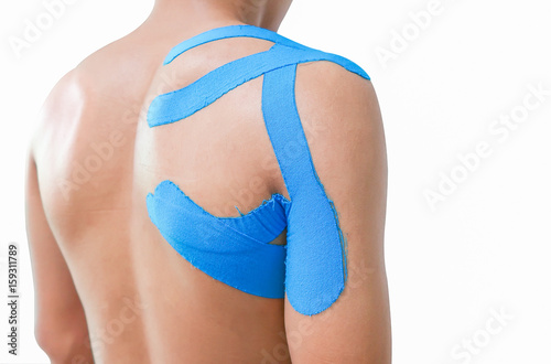 Man with kinesiotaping on the shoulder