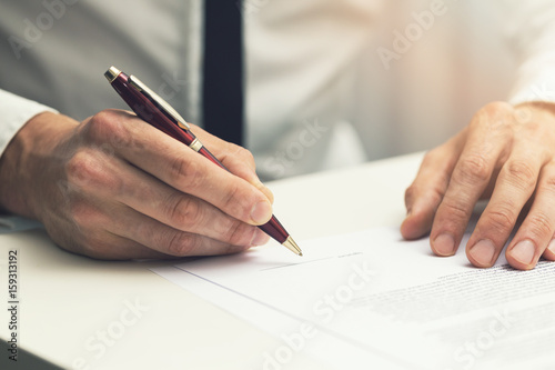 businessman signing business partnership contract photo