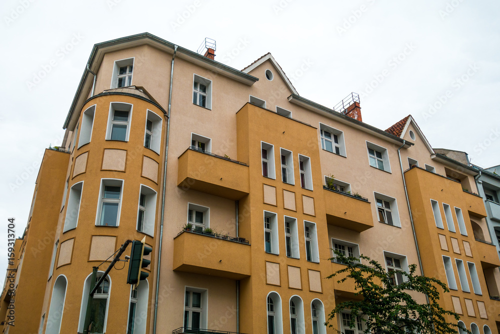 orange and yellow corner house at Friedrichshain berlin