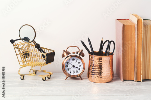 Back to school modern background with books and alarm clock photo