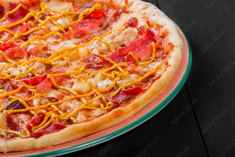 Pizza with chicken, ham, salami, pineapple and mustard on dark wooden background. Homemade pizza Pizza with chicken, ham, salami, pineapple and mustard on dark wooden background. Homemade pizza