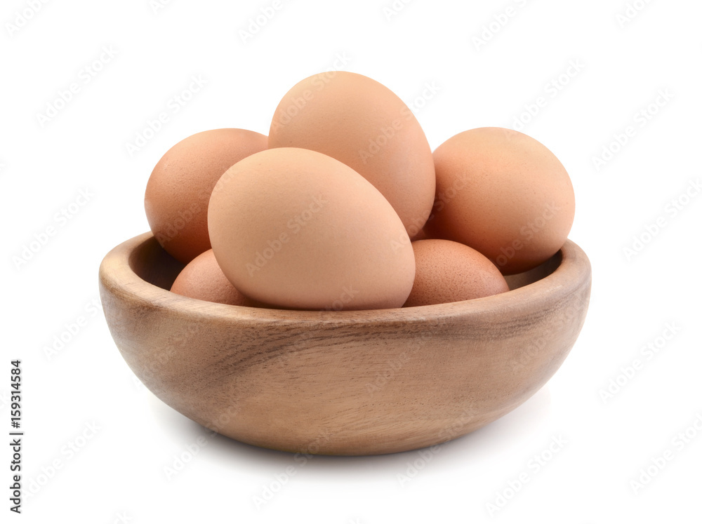 Chicken eggs in a wooden bowl isolated Chicken eggs in a wooden bowl isolated