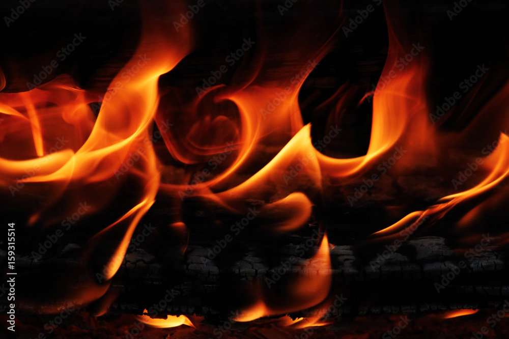 A beautiful evening fire melting away with red coals.