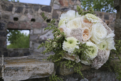 Peachy pinks, white, and green bridal bouquet with Juliet garden roses, O’Hara garden roses, gerondo gerbera daisies, rice flower, privet berries, Jasmine vine photo