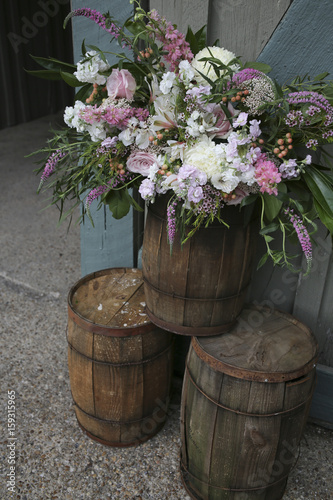 Pink, White, and Green Large Floral Arrangement Wedding Decor on Wine Barrels © holly