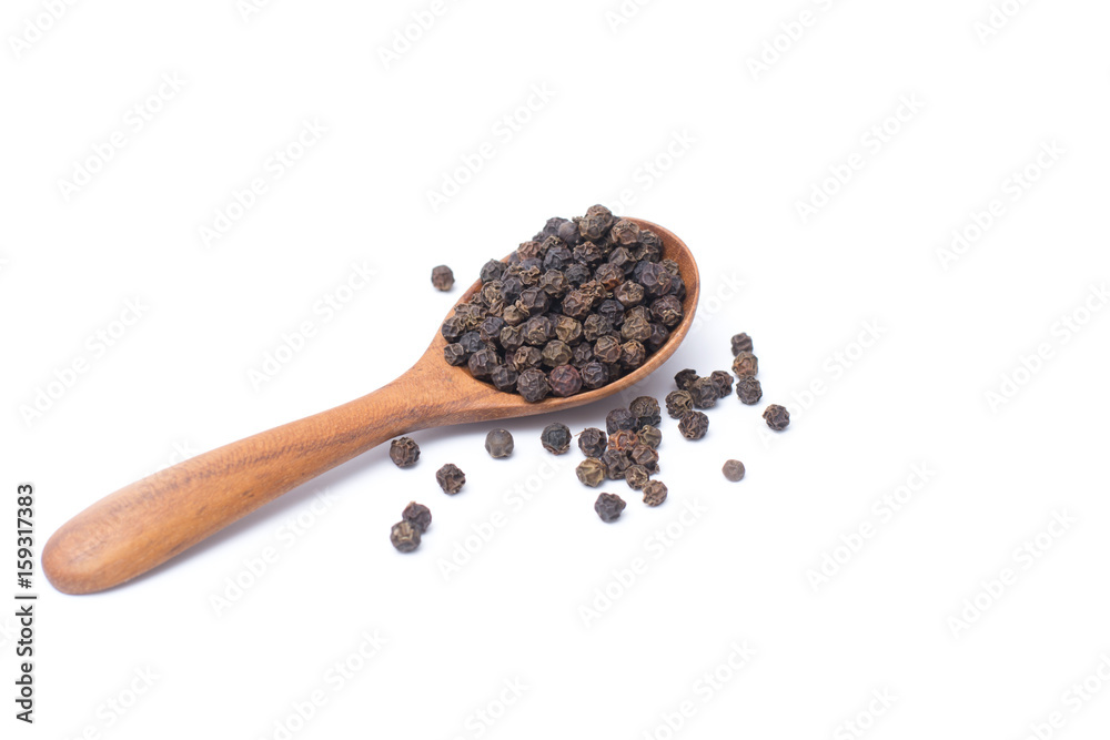 Close up peppercorns in wooden spoon isolated on white background Close up peppercorns in wooden spoon isolated on white background