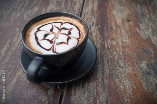 hot coffee with foam milk art in afternoon break