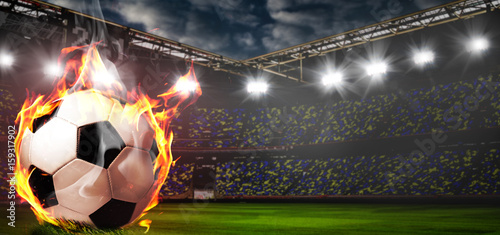 Soccer or football ball on fire at stadium