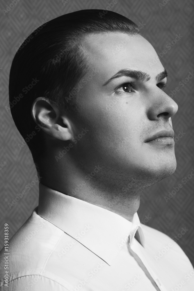 Male beauty concept. Profile portrait of young man with perfect haircut wearing white classic shirt. Old Hollywood star style. Wet hair. Close up. Monochrome studio shot Stock Photo | Adobe Stock Male beauty concept. Profile portrait of young man with perfect haircut wearing white classic shirt. Old Hollywood star style. Wet hair. Close up. Monochrome studio shot Stock Photo | Adobe Stock