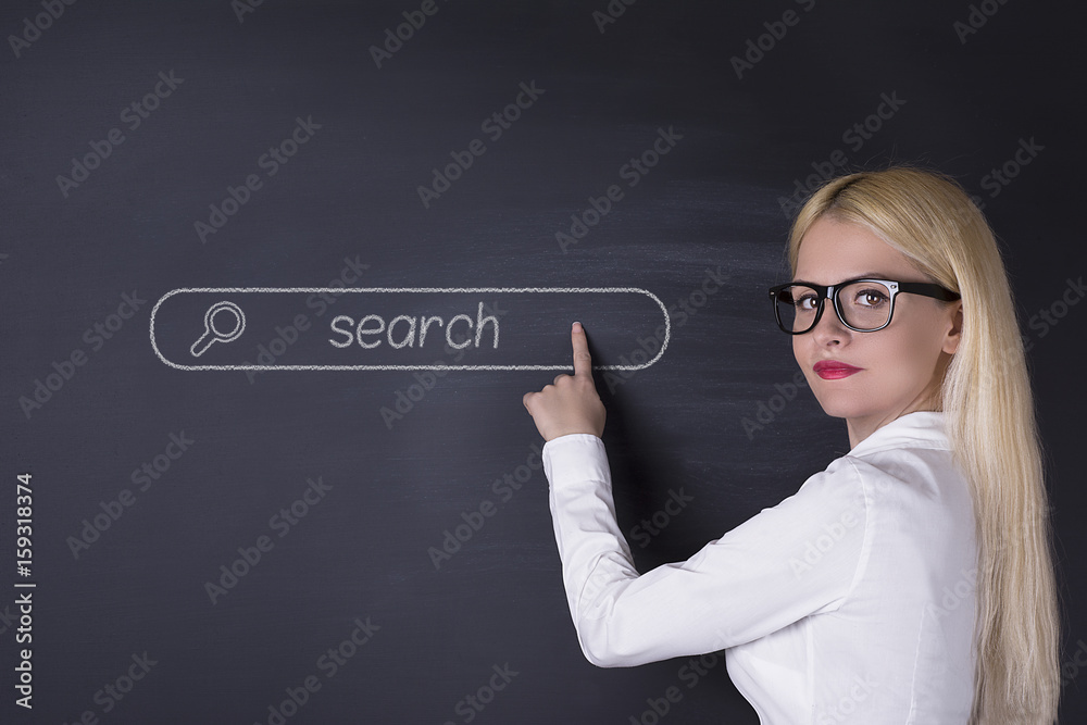 Business woman and search button on blackboard Business woman and search button on blackboard