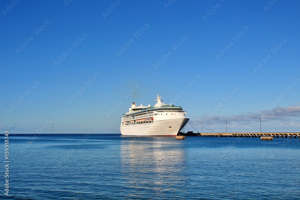 Cruise ship docked on a beautiful blue ocean