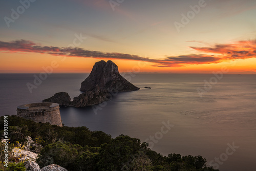 Savinar Tower and Es Vedra island at sunset, Ibiza, Spain