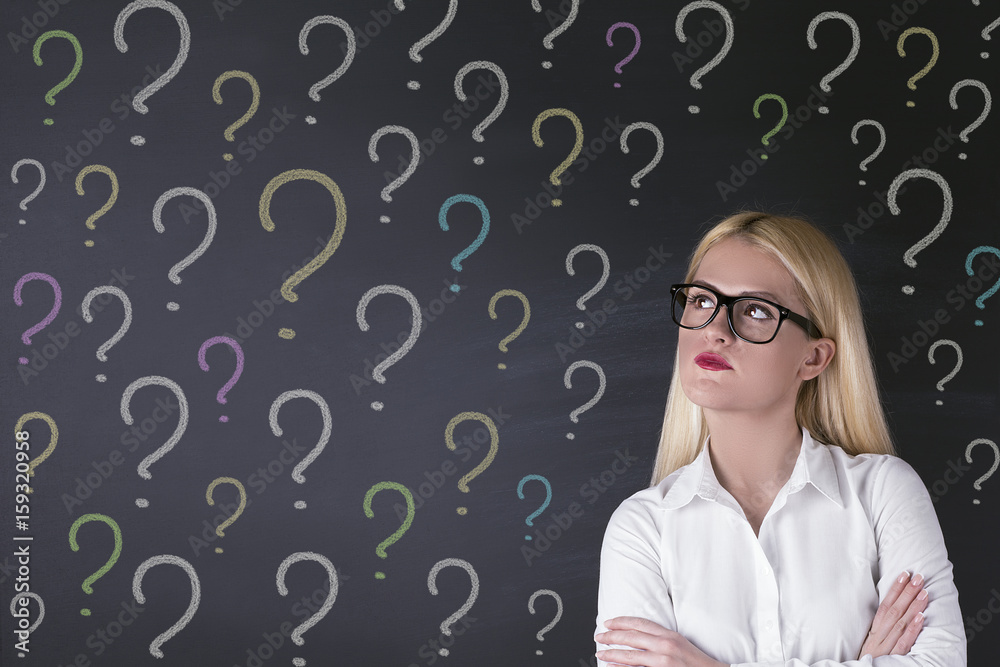 Business woman and question marks Business woman and question marks