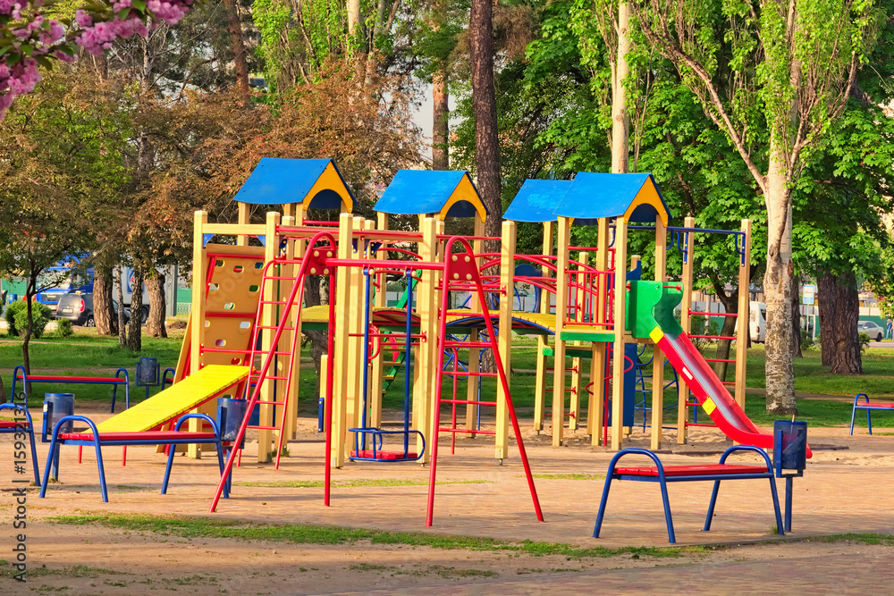 An empty children's playground is waiting for children. The early spring morning in Kyoto Park (japanese garden). Kyiv(Kiev). Ukraine An empty children's playground is waiting for children. The early spring morning in Kyoto Park (japanese garden). Kyiv(Kiev). Ukraine