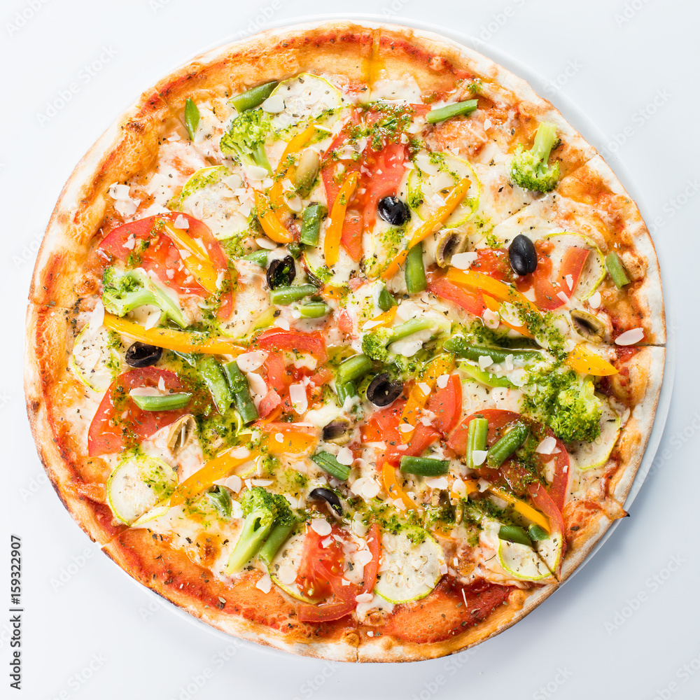 Vegetarian pizza with broccoli, green beans, olives and tomatoes