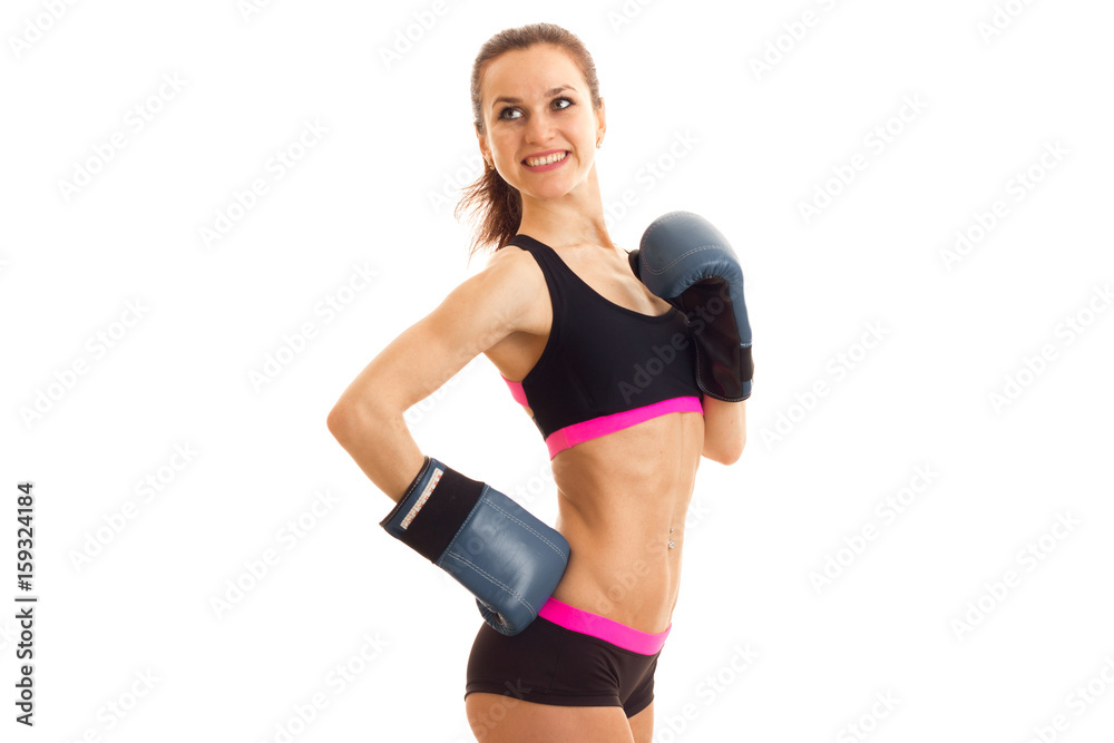 energetic smiling athlete stands in boxing gloves and the top energetic smiling athlete stands in boxing gloves and the top