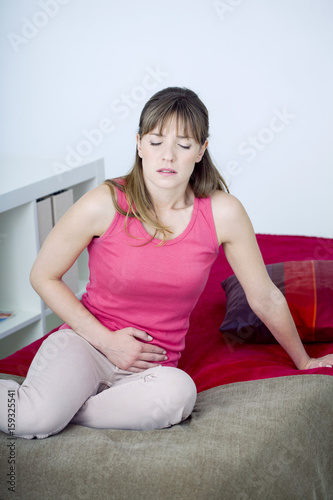 Woman suffering from abdominal pain