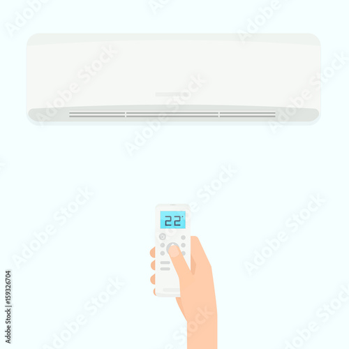 Hand holding air conditioner remote control