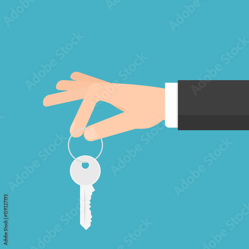 hand holding house key