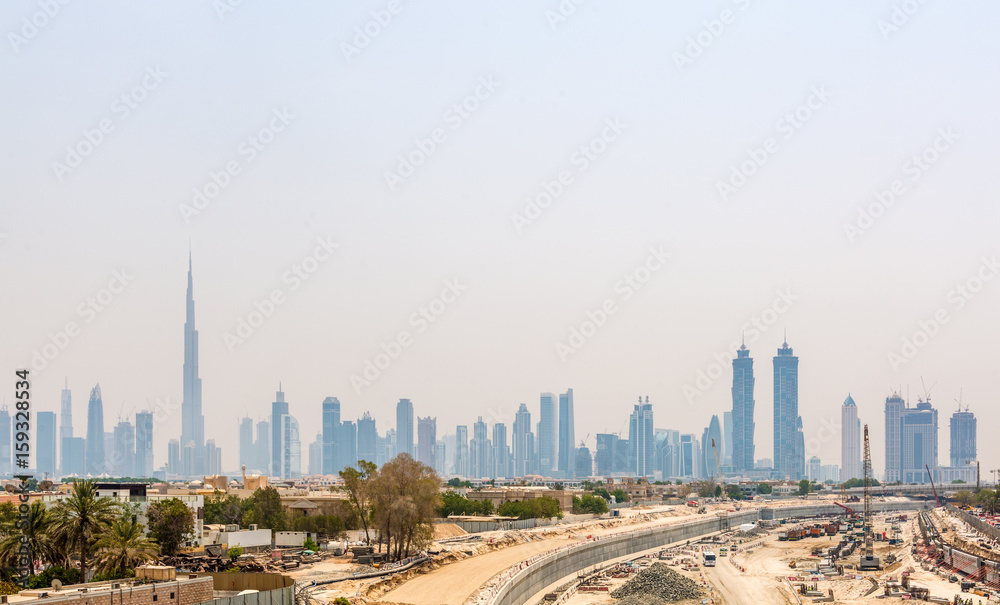 Fototapeta premium Hazy City Skyline with Burj Khalifa Skyscraper