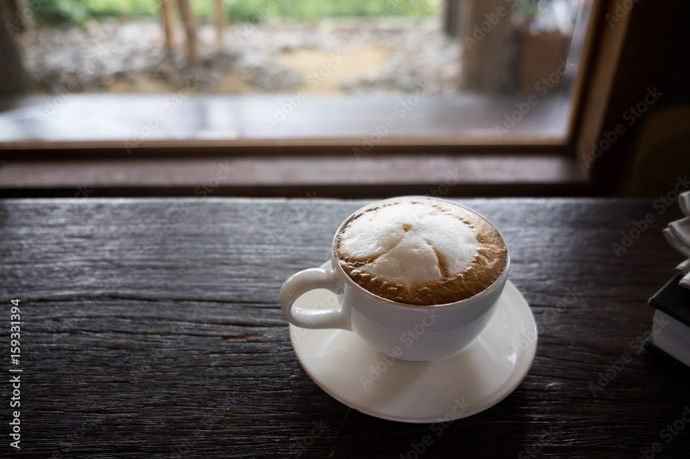 Coffee cup at coffee shop on glasses table with old vintage wooden ...