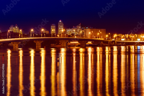 Havana bridge in Kiev at night with colorful illumination and reflection in Dnieper river © Roxana