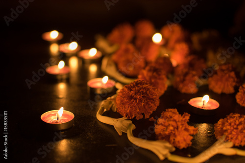 Deepabali - colourful candles are lit in darkness photo