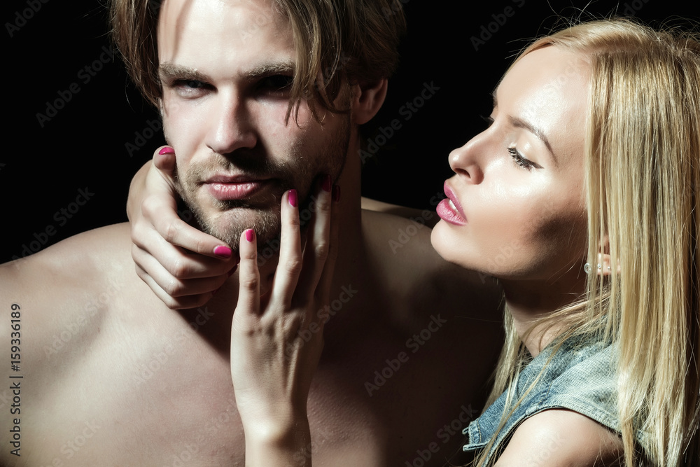 woman touching unshaven cheek of handsome man woman touching unshaven cheek of handsome man