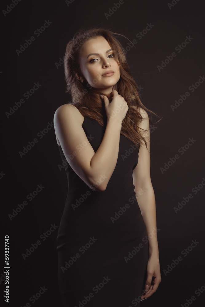 Beautiful female model with lush brunette hair posing at studio Beautiful female model with lush brunette hair posing at studio