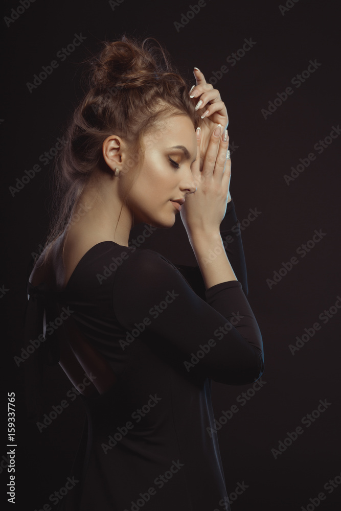 Portrait of tender brunette woman in the dark room Portrait of tender brunette woman in the dark room