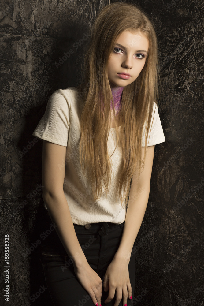 Fototapeta premium Glorious young model with bright makeup and violet glitter on her neck