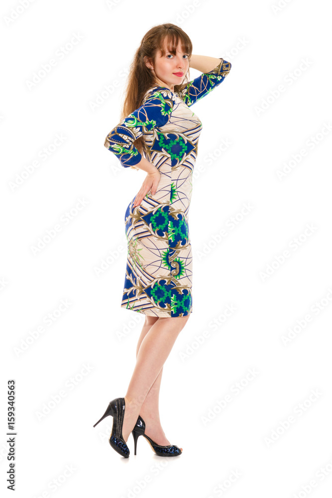 Attractive girl in the slinky dress and in shoes on a high heel. Isolated on a white Attractive girl in the slinky dress and in shoes on a high heel. Isolated on a white