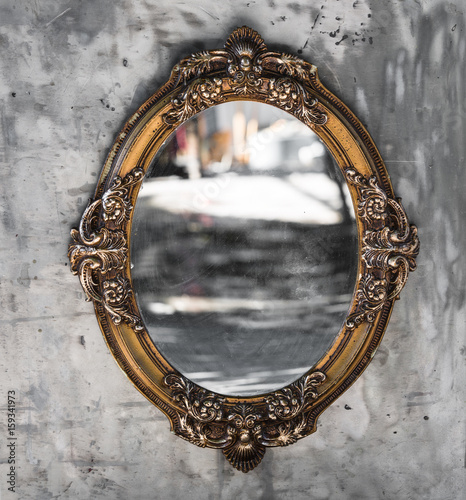 Old, Victorian, gilded, decorative frame with a mirror, baroque, rococo, the Renaissance