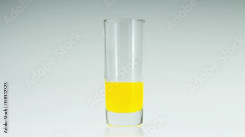 Orange juice in the glass on white background.