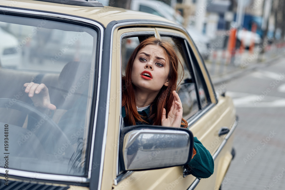 Woman driving a retro car, young woman driving a car Woman driving a retro car, young woman driving a car